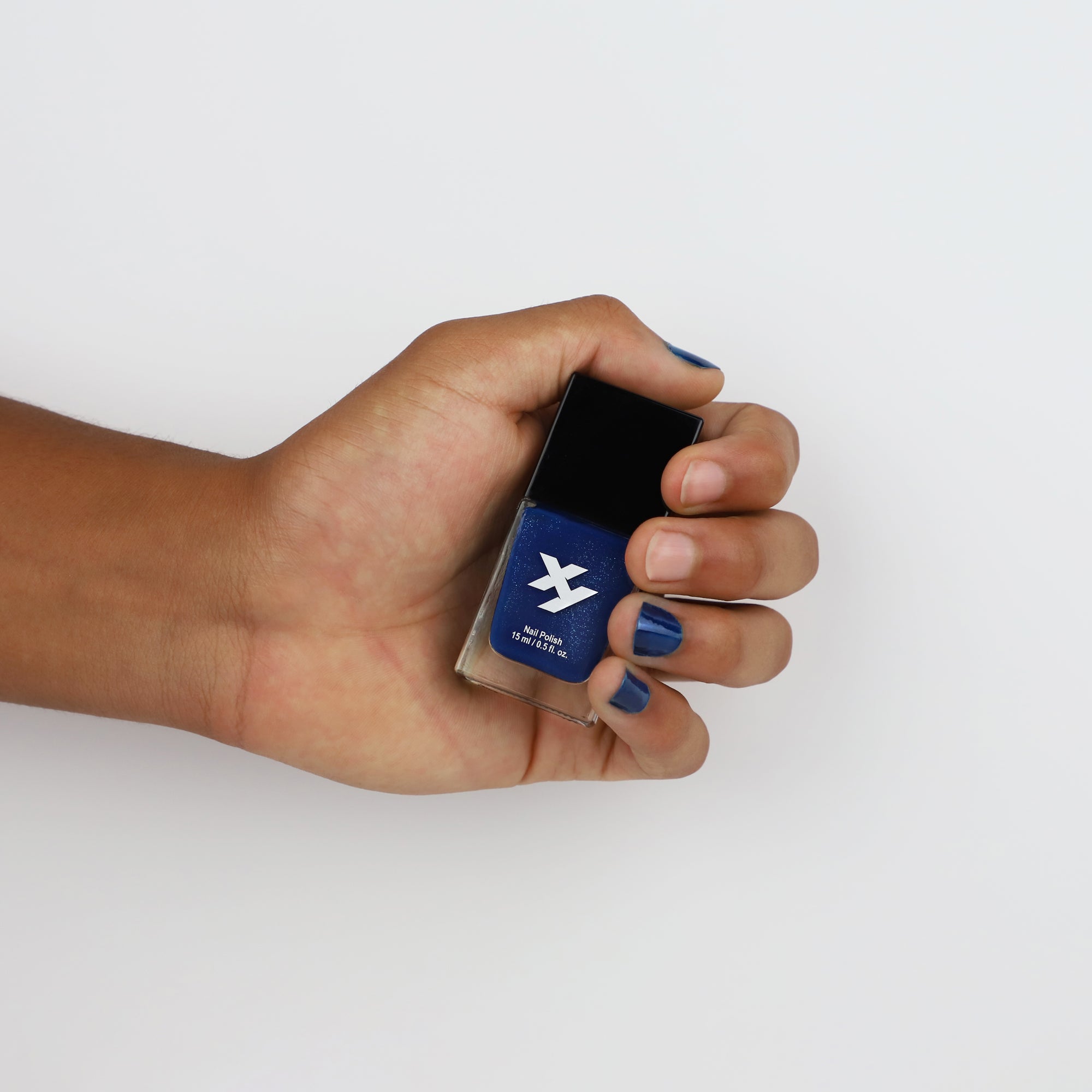 Model holding a bottle of Night Owl Y nail polish.