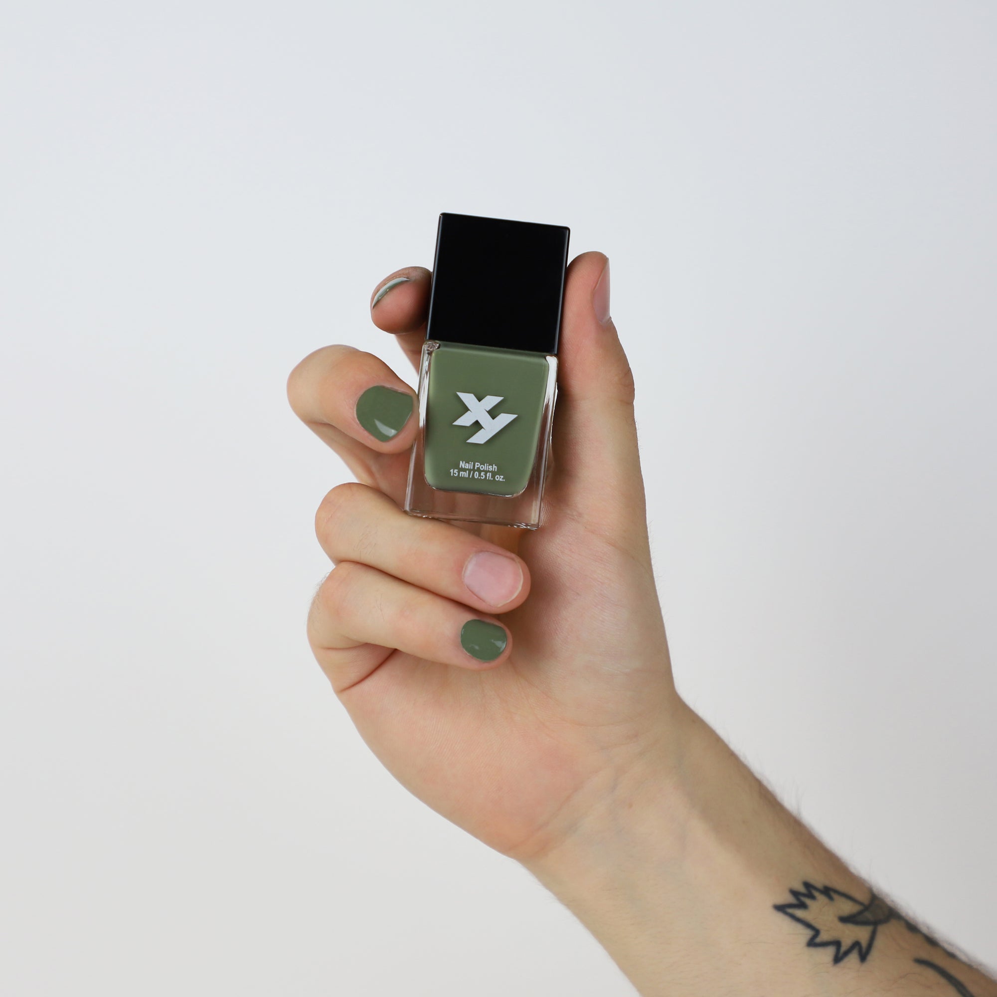 Model holding a bottle of Wanderer X nail polish